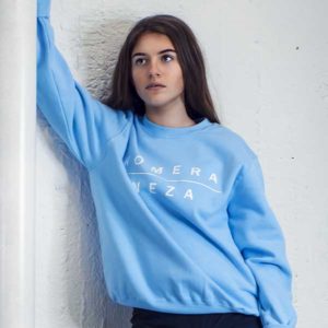 womens baby blue sweatshirt with white komera neza print logo