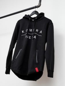 black zipper hoodie with white komera neza print logo