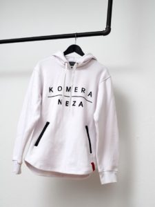 white zipper hoodie with black komera neza print logo