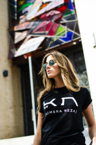 womens black t-shirt with white komera neza print logo