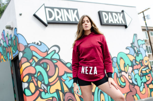womens burgundy pocketless hoodie with white komera neza print logo
