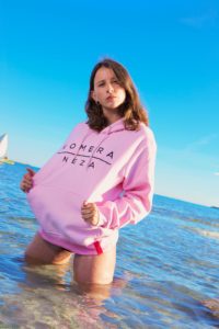 womens pink hoodie with black komera neza print logo