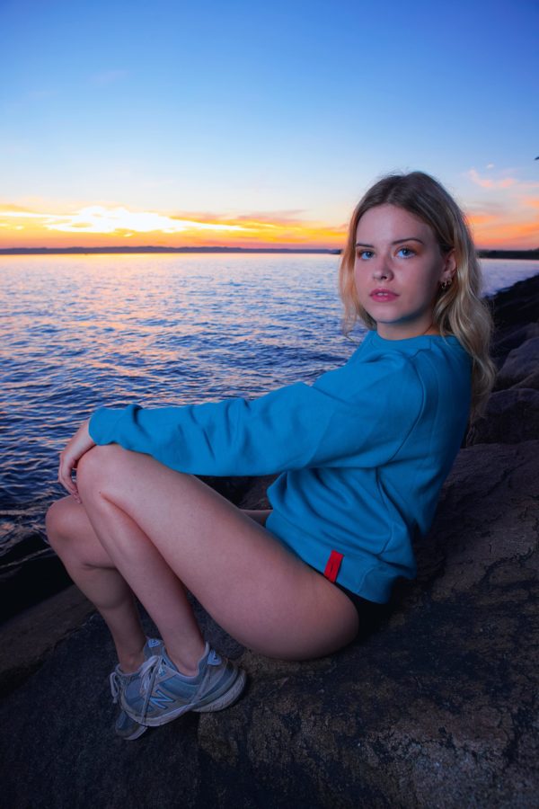 women's blue logo sweatshirt with embroidered komera neza logo