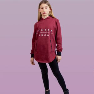 kid wearing burgundy zipper hoodie with white komera neza print logo