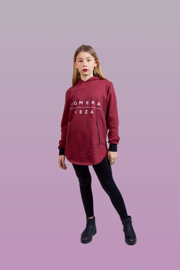 kid wearing burgundy zipper hoodie with white komera neza print logo