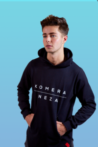 man wearing black zipper hoodie with white komera neza print logo